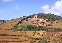 Mountain showing soil erosion due to over–use of fertilizers, destruction of forests/grassland, etc. Sparse mountain showing soil erosion